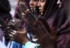Tuareg women clap their hands during the official visit