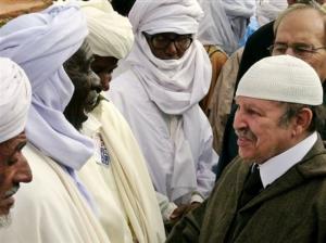Algerian President Abdelaziz Bouteflika, right, meets Touareg men in
