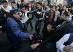 Secondary school students shout slogans during a protest held