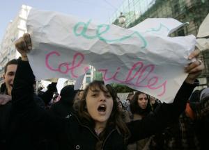 Secondary school students shout slogans during a protest held