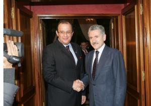 Moroccan Foreign Minister Taieb Fassi-Fihri (L) welcomes his Italian