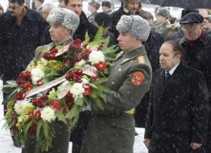Algeria's President Abdelaziz Bouteflika (2nd R) attends a wreath-laying