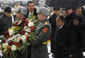 Algerian President Abdelaziz Bouteflika, right, takes part at a