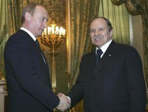Russian President Vladimir Putin, left, greets Algerian President Abdelaziz