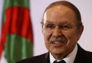 Algeria's President Abdelaziz Bouteflika smiles as he gives a