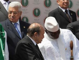 Gambia's President Yahya Jammeh, right, talks with Algeria's President