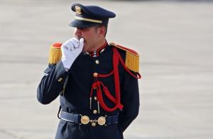 A Syrian honour guard yawns during the welcoming ceremony