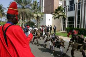 A member of Senegalese republican guard takes a picture