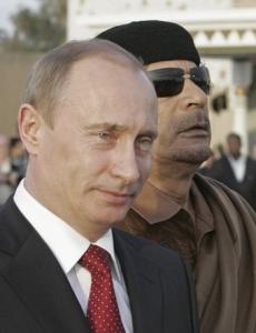 Russian President Vladimir Putin (L) walks on April 16,