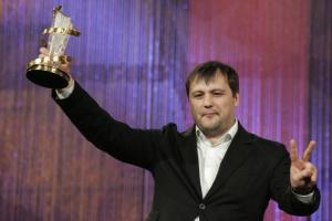 Russian film director Alexei Mizgirev holds the golden star