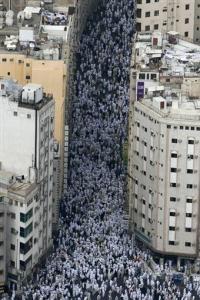 Muslims walk in the streets as they leave the