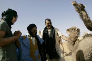 Spanish actor Javier Bardem (L) interacts with a Saharawi