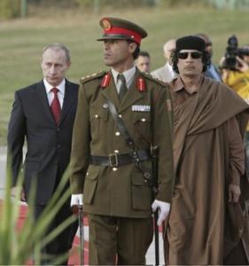 Russian President Vladimir Putin (L) walks on April 16,