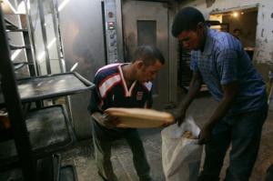 Two Sahrawi men work in a bakery at Dakhla's