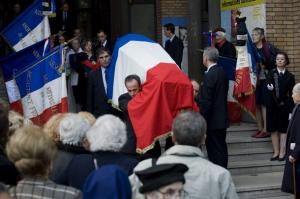 The coffin bearing the remains of Germaine Tillion leaves