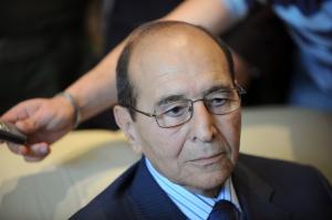 Algerian Interior Minister Noureddine Yazid Zerhouni sits during a