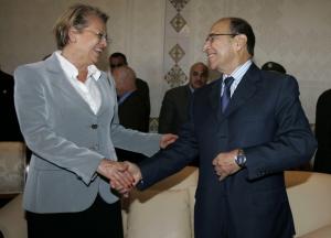 Algeria's Interior Minister Noureddine Yazid Zerhouni (R) shakes hands