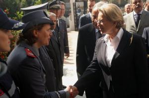 French Interior Minister Michele Alliot Marie (R) shakes hand