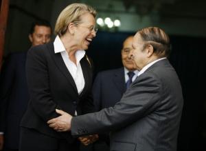 Algeria's President Abdelaziz Bouteflika (R) greets French Interior Minister