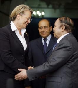 Algeria's President Abdelaziz Bouteflika (R) greets French Interior Minister