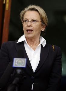 French Interior Minister Michele Alliot-Marie answers A journalist's question