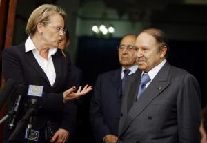 Algeria's President Abdelaziz Bouteflika (R) listens as French Interior