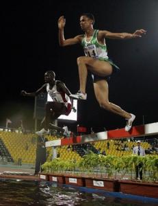 Rabie Makhlouf of Algeria (R) competes in the men's