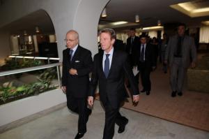 Algerian Foreign Minister Mourad Medelci (L) walks with his
