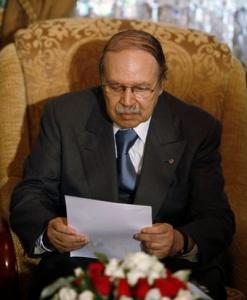 Algeria's President Abdelaziz Bouteflika reads a letter from his