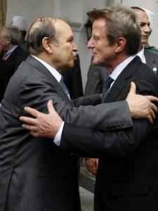 Algeria's President Abdelaziz Bouteflika (L) greets France's Foreign Minister