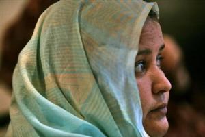 Al Afia Hammidi listens during a press interview in