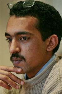 Said Abderahman listens during a press interview in New