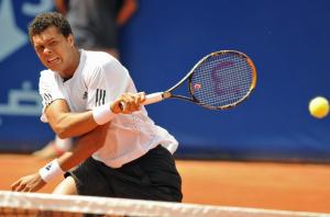 France's Wilfried Tsonga returns a forehand to Algeria's Lamine