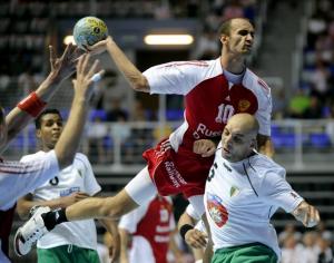 Timur Dibirov (up) of Russia tries to score over