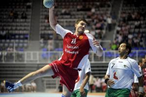 Alexander Chernoivanov (L) of Russia tries to score as