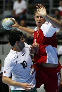 Egor Evdokimov (R) of Russia shoots a ball over