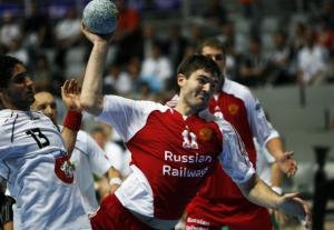 Alexander Chernoivanov (R) of Russia shoots the ball in