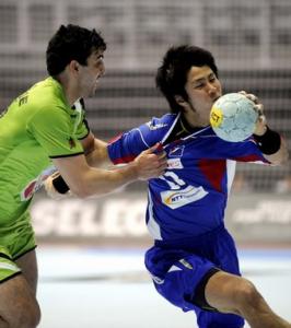 Masayuki Furuie (R) of Japan vies with Saci Boultif