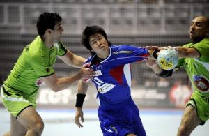 Kairi Kochi (with ball) of Japan tries to score