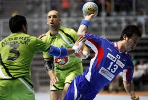 Hidenori Kishikawa (R) of Japan shoots as Omar Chehbour