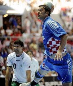 Igor Vori of Croatia (R) tries to shoot as