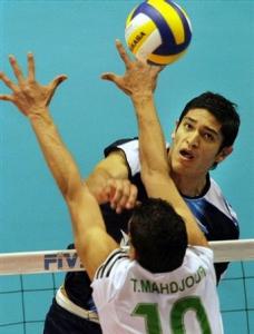 Lucas Ocampo of Argentina spikes the ball against Mahdjoubi