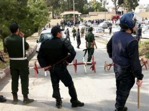 Gendarmes and police officers secure the area of an