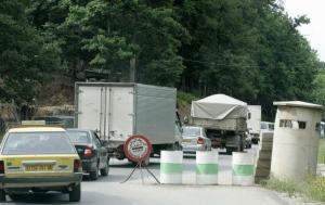 Cars queue at an army checkpoint in Algeria's Kabylie