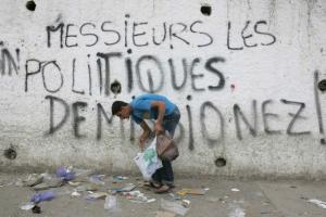 A man collects rubbish in Tiziouzou, 100km (62 miles)