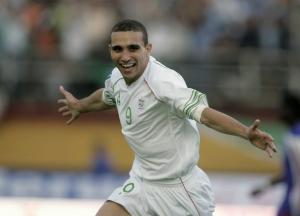 Algeria's Djebbour Rafik celebrates after the team scored against