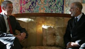 Algeria's Prime Minister Abdelaziz Belkhadem (R) chats with his