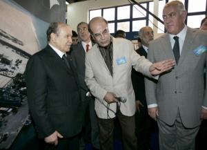 Algeria's President Abdelaziz Bouteflika (L) listens to a presentation