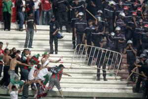 Fans of JSM Bejaia clash with riot police during