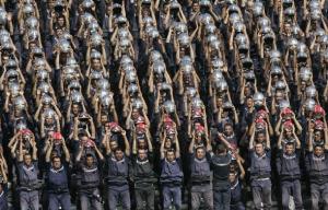 Algerian rescue workers perform in the stands during the